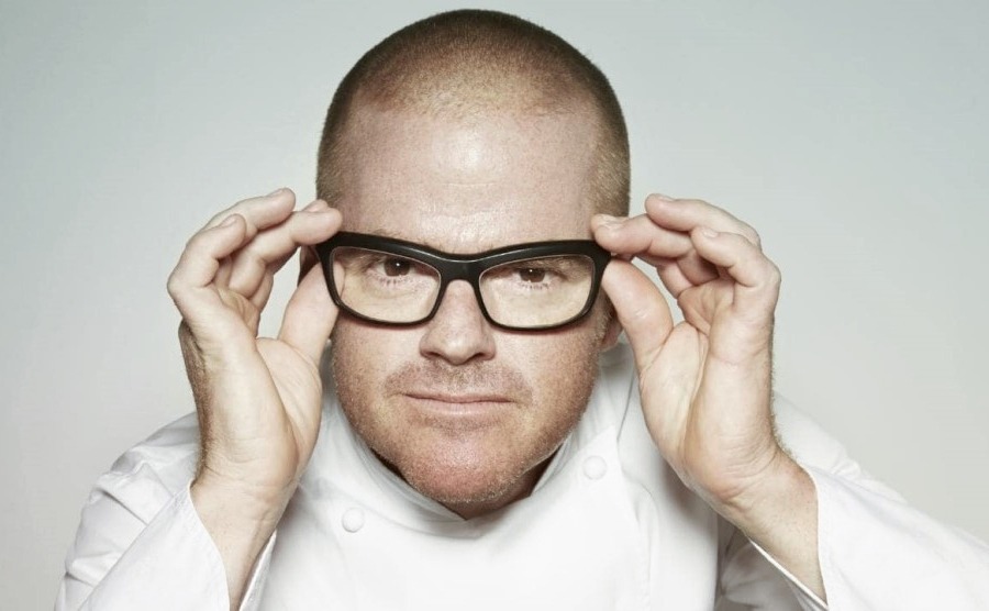 Heston Blumenthal (6 Michelin Stars) is holding his glasses 