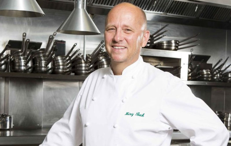 Heinz Bek (5 Michelin stars) poses in the restaurant kitchen